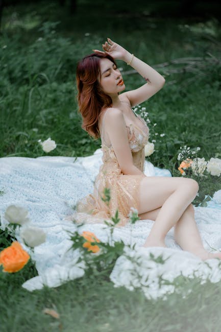 Woman in a comfortable white outfit meditating in a serene pose
